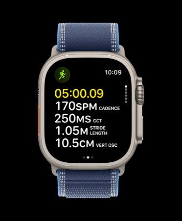Apple Watch, screen shows advanced mid-run metrics: running time, cadence, ground contact time, stride length, vertical oscillation